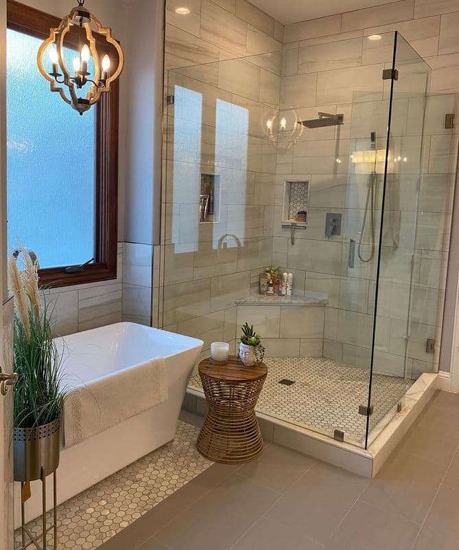 Modern bathroom featuring a glass shower, freestanding tub, and elegant decor elements.