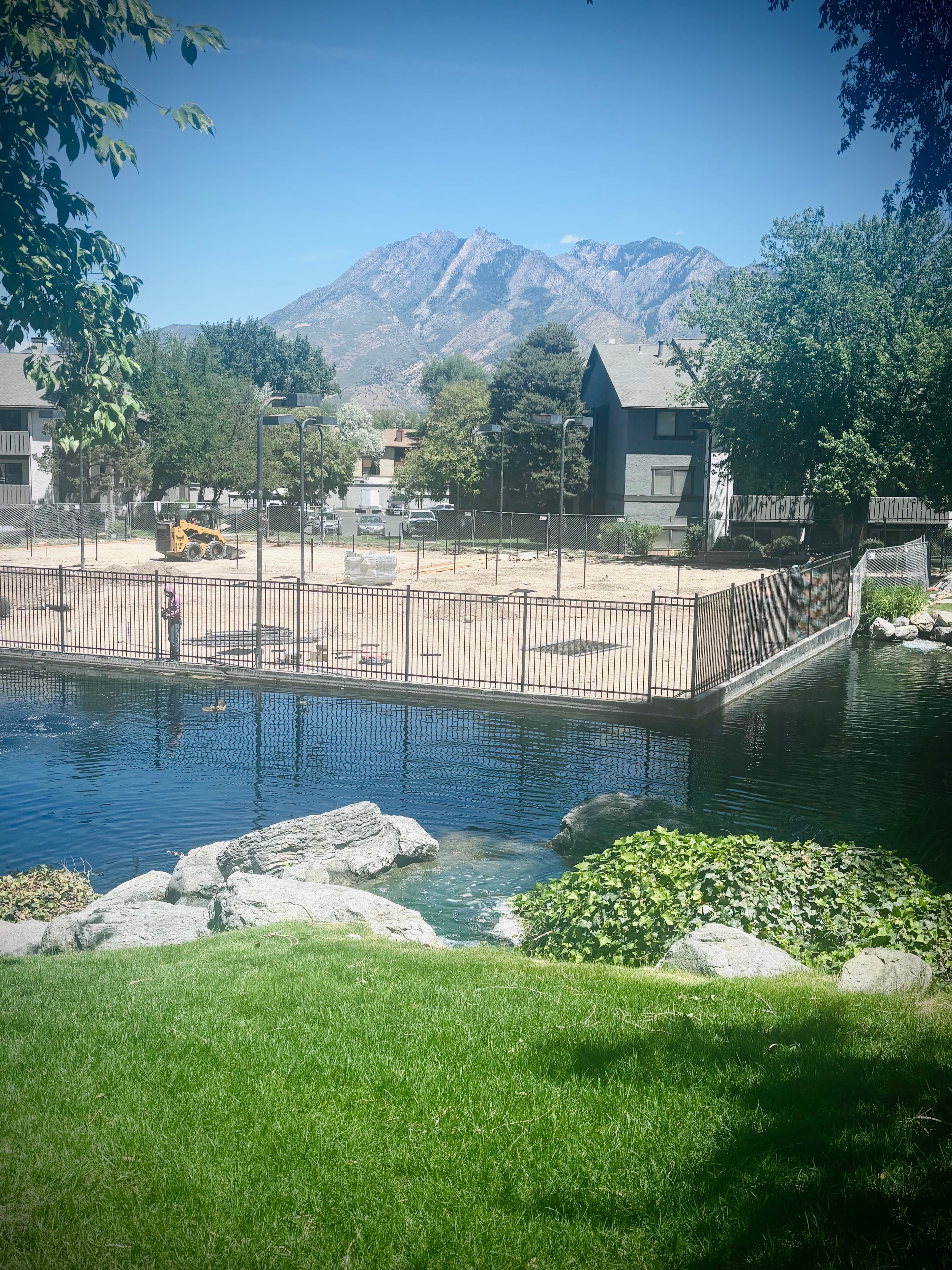 Project Iron Rod Fence Installation Around a Court and Pond Area image